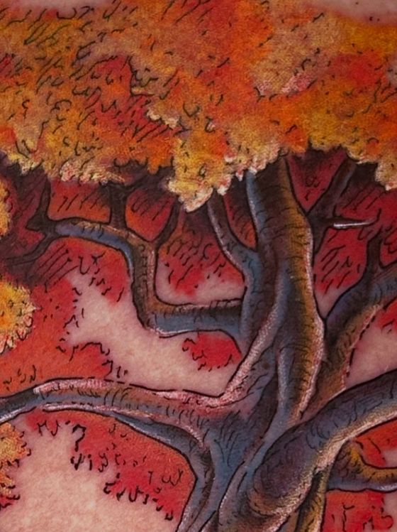 Color autumn tree tattoo with red and orange leaves
